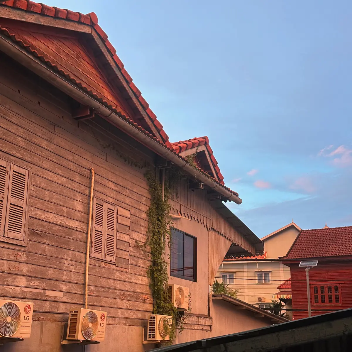 Sunset sky over the wooden houses around The Temple.