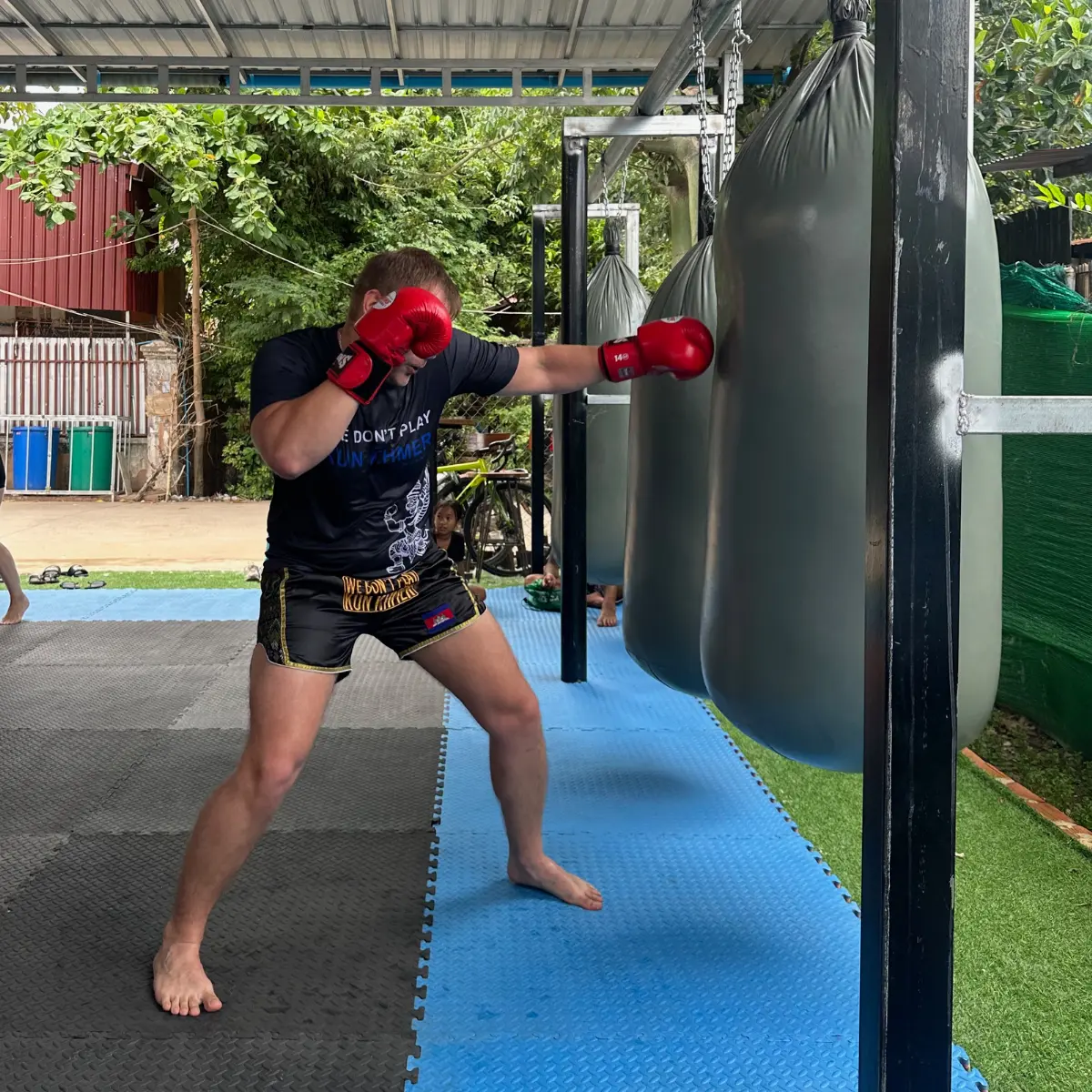A student practising punches on a heavy bag at The Temple.